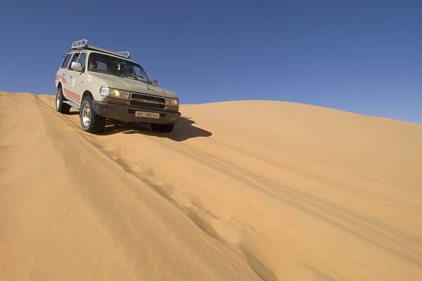 SUV on sand dunes