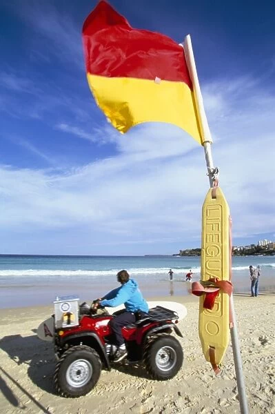 Swimming flag and patrolling lifeguard at Bondi Beach, Sydney, New South Wales
