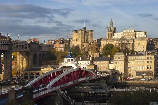 Swing Bridge crossing the River Tyne, 12th century Norman Castle Keep and the Lantern of the Cathedral Church of St. Nicholas, Newcastle upon Tyne, Tyne and Wear, England, United Kingdom, Europe