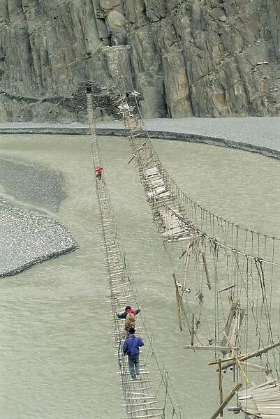 Swinging bridges over river