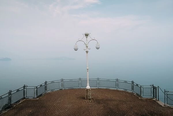 A symmetrical spot with a lamp overlooking Lake Maggiore, Piedmont, Italian Lakes