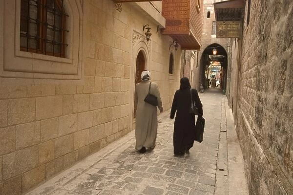 Syrian women walking through old town