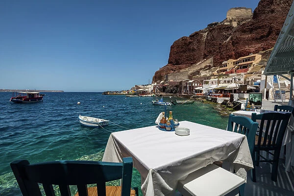 A table with a view at one of the seafood restaurants in Ammoudi Bay (Amoudi) at