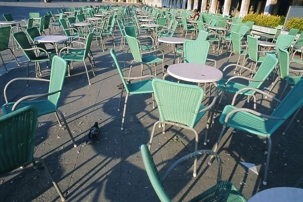 Empty tables and chairs outside cafe in Venice