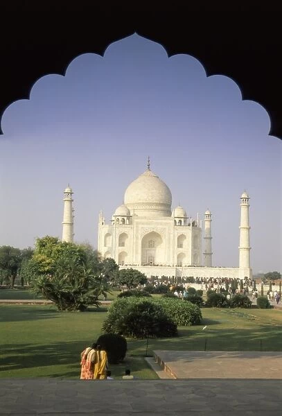 The Taj Mahal through ornate archway