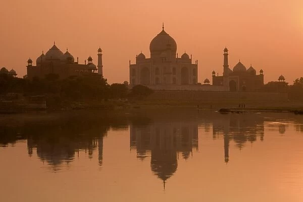 Taj Mahal reflected in the Yamuna River at sunset, UNESCO World Heritage Site, Agra, Uttar Pradesh, India, Asia