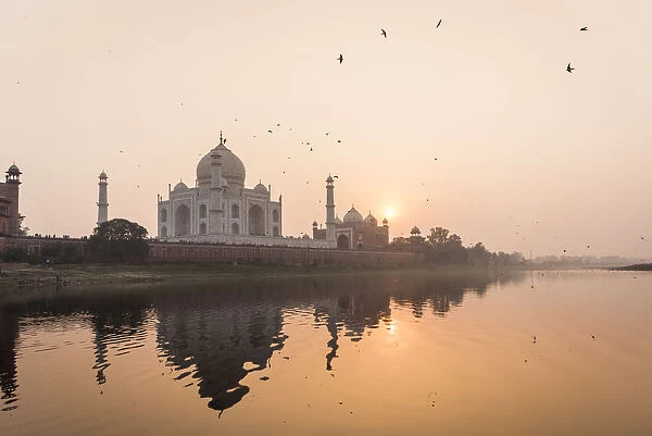 Taken from a boat on the River Yamuna behind the Taj Mahal at sunset, UNESCO World