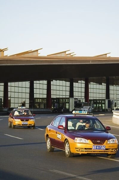 Taxis leaving Beijing Capital Airport part of new Terminal 3 building opened February 2008