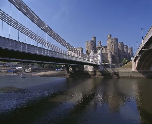 Telford Suspension Bridge, opened in 1826, crossing the River Conwy with Conwy Castle