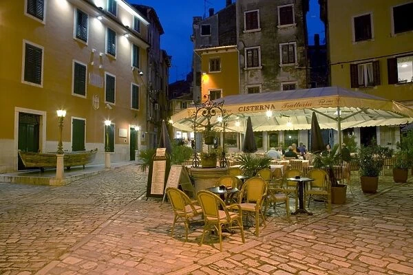 Terrace of attractive trattoria in the old town at dusk, Rovinj (Rovigno)