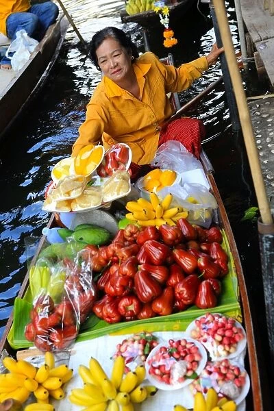 Thai woman selling fruit at floating market, Bangkok, Thailand, Southeast Asia, Asia