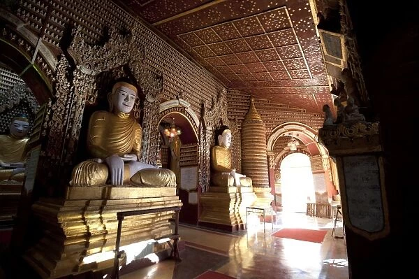 Thanboddhay Pagoda, showing some of the 100000 Buddhas there, large and small lined up on shelves