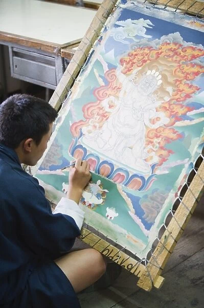 Thangka painter at the National Institute for Zorig Chusum Pedzoe, (Painting School)