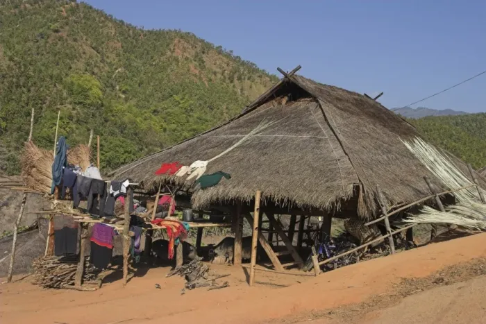 Framed Print : Thatched house with clothes drying, Ann Village, Kengtung (Kyaing Tong) Framed Print : Thatched house with clothes drying, Ann Village, Kengtung (Kyaing Tong)