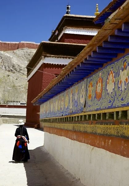 Tibetan Pilgrim circling the base of Kumbum chorten (Stupa) in the Palcho Monastery at Gyantse, Tibet, China, Asia
