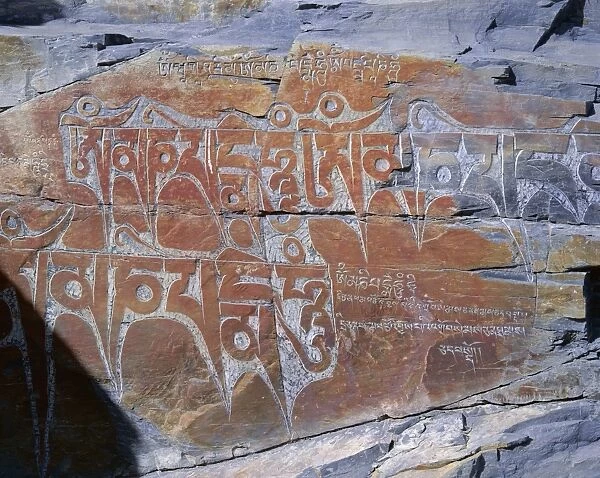 Tibetan script carved in rock face, Lhasa, Tibet, China, Asia