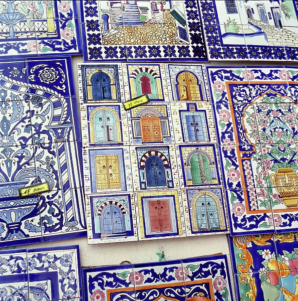 Tiles decorated with Tunisian doorways on souvenir stall, Hammamet, Cap Bon