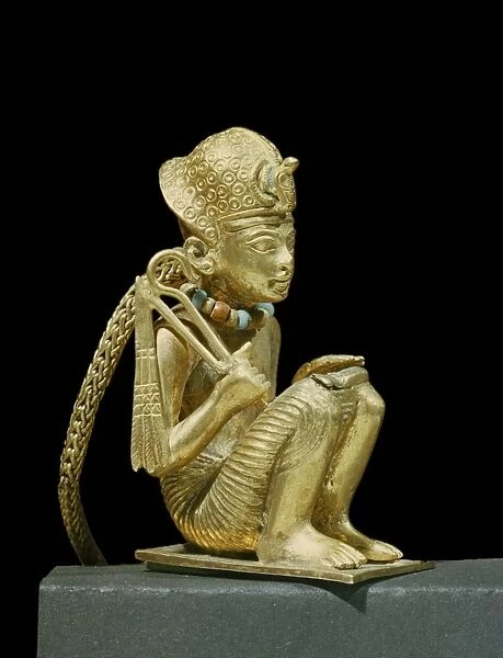 Tiny solid gold statuette of Amenophis III found in a small mummiform coffin in the tomb of the pharaoh Tutankhamun, discovered in the Valley of the Kings, Thebes, Egypt, North