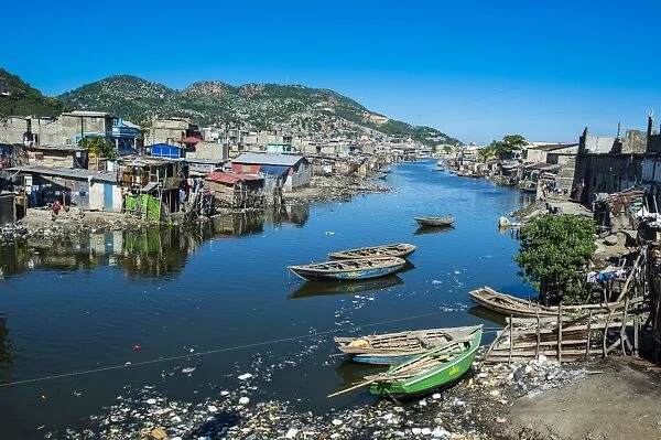 Totally polluted River Mapou flowing through Cap Haitien, Haiti, Caribbean, Central