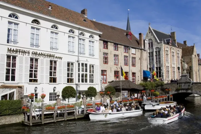 Framed Print : Tour boat on the canal in Bruges, West Flanders, Belgium, Europe Framed Print : Tour boat on the canal in Bruges, West Flanders, Belgium, Europe