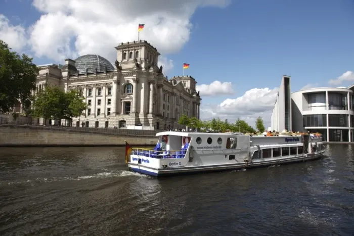 Framed Print : Tour boat on river cruise on the Spree River passing the Reichstag (Parliament) Framed Print : Tour boat on river cruise on the Spree River passing the Reichstag (Parliament)