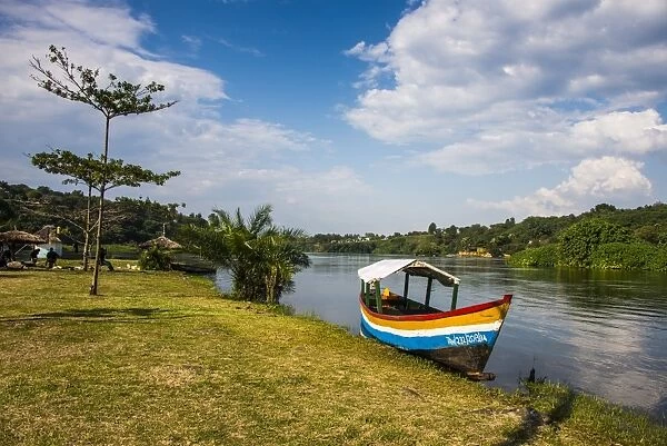 Tourist boat anchoring on a little island at the source of the Nile, where the Nile starts, Jinja, Uganda, East Africa, Africa