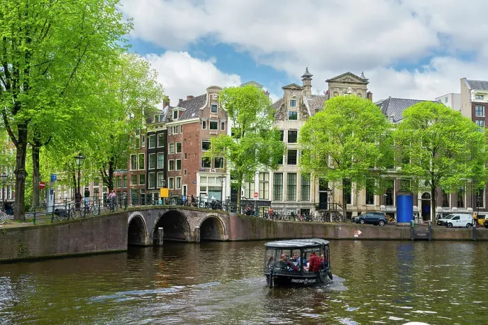 Framed Print : Tourist boat on Herengracht canal, Amsterdam, The Netherlands, Europe Framed Print : Tourist boat on Herengracht canal, Amsterdam, The Netherlands, Europe