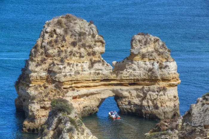 Framed Print : Tourist boat manoeuvering through the Grotos of Ponta da Piedade, Algarve, Portugal Framed Print : Tourist boat manoeuvering through the Grotos of Ponta da Piedade, Algarve, Portugal