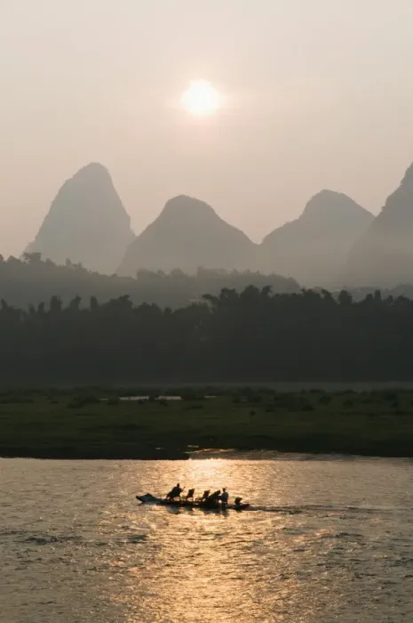 Framed Print : Tourist boat sailing through karst scenery at sunrise on the Li river Framed Print : Tourist boat sailing through karst scenery at sunrise on the Li river