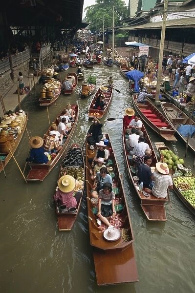 Tourist boats on the klong at the Floating Market at