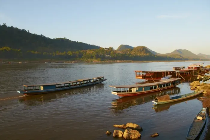 Framed Print : Tourist boats at sunset on the Mekong River, Luang Prabang, Laos, Indochina Framed Print : Tourist boats at sunset on the Mekong River, Luang Prabang, Laos, Indochina