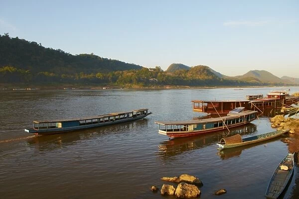 Tourist boats at sunset on the Mekong River, Luang Prabang, Laos, Indochina