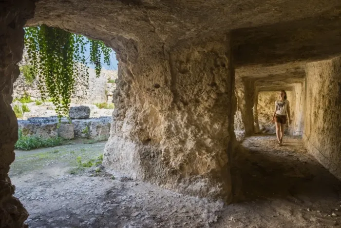 Framed Print : Tourist exploring the tunnels at the Greek ruins, Eurialo Casle (Castello Eurialo), Syracuse (Siracusa), Sicily, Italy, Europe Framed Print : Tourist exploring the tunnels at the Greek ruins, Eurialo Casle (Castello Eurialo), Syracuse (Siracusa), Sicily, Italy, Europe