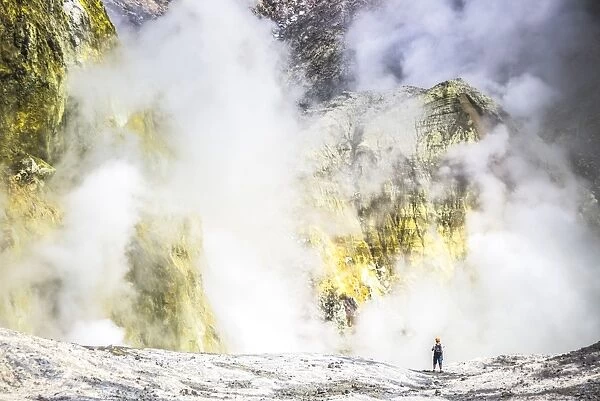 Tourist exploring White Island Volcano, an active volcano in the Bay of Plenty, North Island