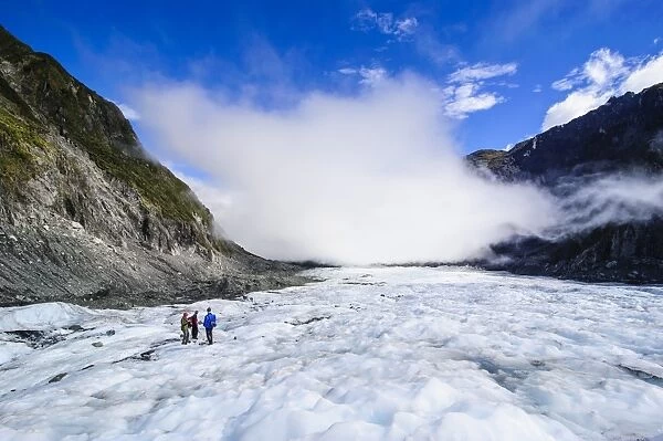 Tourist hiking on Fox Glacier, Westland Tai Poutini National Park, South Island, New Zealand, Pacific