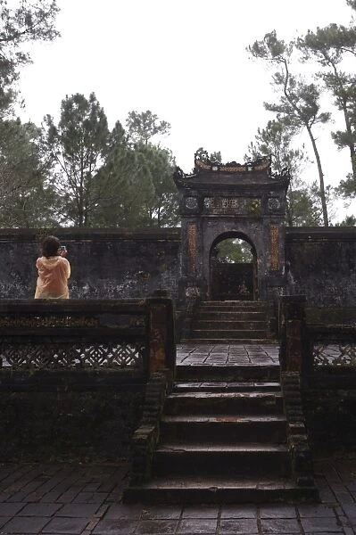 Tourist photographing Dai Hong Mon, Minh Mang Tomb, Hue, Vietnam, Indochina