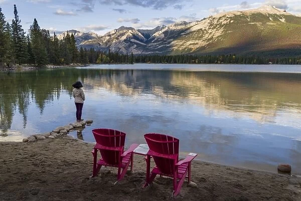 Tourist and Red Chairs by Lake Edith, Jasper National Park, UNESCO World Heritage Site