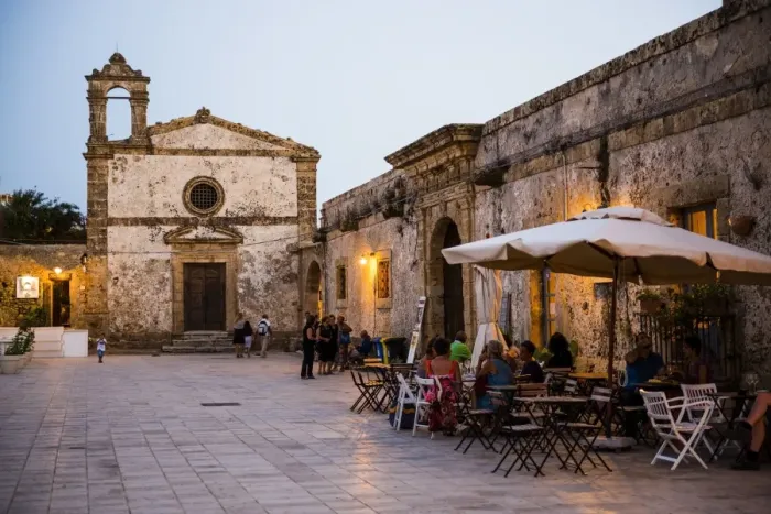 Framed Print : Tourist at a restaurant, Church of St Francis of Paolo in the main square, Marzamemi, Sicily, Italy, Europe Framed Print : Tourist at a restaurant, Church of St Francis of Paolo in the main square, Marzamemi, Sicily, Italy, Europe