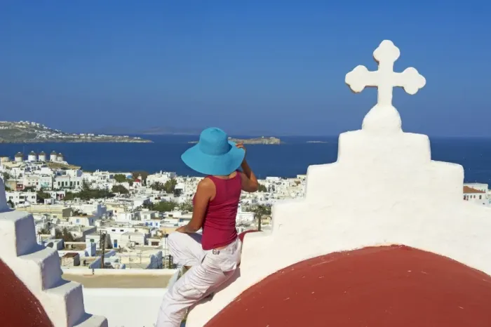 Framed Print : Tourist on roof of red church above the old town, Mykonos town, Chora, Mykonos Framed Print : Tourist on roof of red church above the old town, Mykonos town, Chora, Mykonos