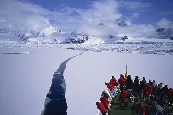 Tourist ship breaking through pack-ice, Antarctic Peninsula, Polar Regions