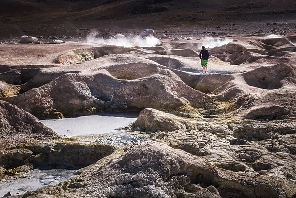 Tourist at Sol de Manana Geothermal Basin area, Altiplano of Bolivia, South America