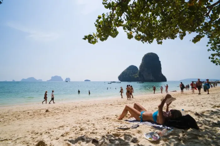 Framed Print : Tourist sunbathing and reading on Ao Phra Nang Beach, Railay (Rai Leh), South Thailand, Southeast Asia, Asia Framed Print : Tourist sunbathing and reading on Ao Phra Nang Beach, Railay (Rai Leh), South Thailand, Southeast Asia, Asia