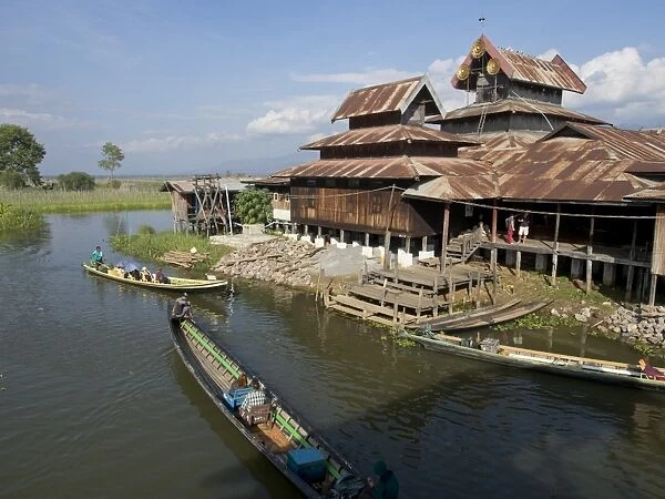 Tourists arrive by boat at monastery on Inle Lake, Shan State, Myanmar (Burma), Asia