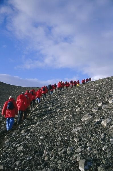 Tourists ascending recent volcanic cone, Penguin Island, South Shetland Islands
