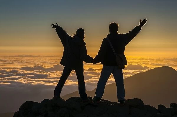 Tourists in backlight waiting for sunset on top of Haleakala National Park, Maui, Hawaii, United States of America, Pacific