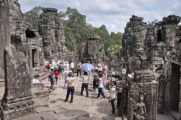 Tourists at The Bayon, Angkor Thom, Angkor, UNESCO World Heritage Site, Siem Reap, Cambodia, Indochina, Southeast Asia, Asia