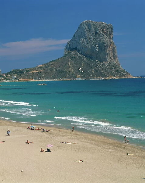 Tourists on the beach at Calpe and the Penon de Ifach