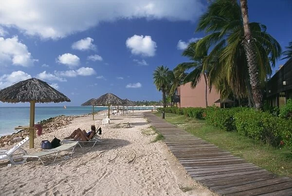 Tourists on beach at the Tamarijn Beach Resort, Aruba, West Indies, Caribbean