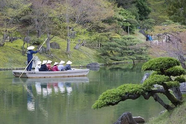 Tourists on boat in Ritsurin-koen, Takamatsu, Shikoku, Japan, Asia