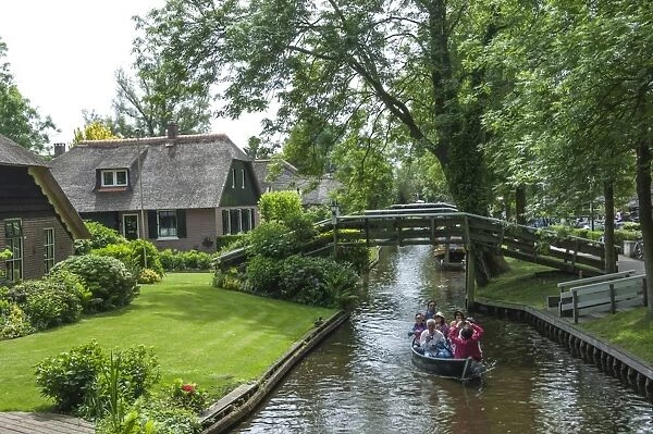 Tourists on the canal at Giethorn, Holland, Europe